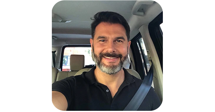Trimology satisfied male customer smiling in a car, showcasing successful weight management and everyday vitality results from the metabolic support supplement.